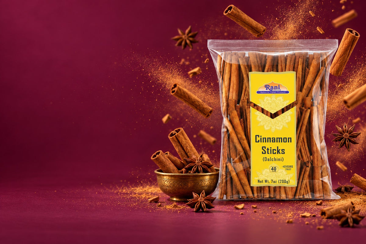 Rani Cinnamon Sticks bag with tumbling cinnamon sticks and star anise on a deep plum backdrop